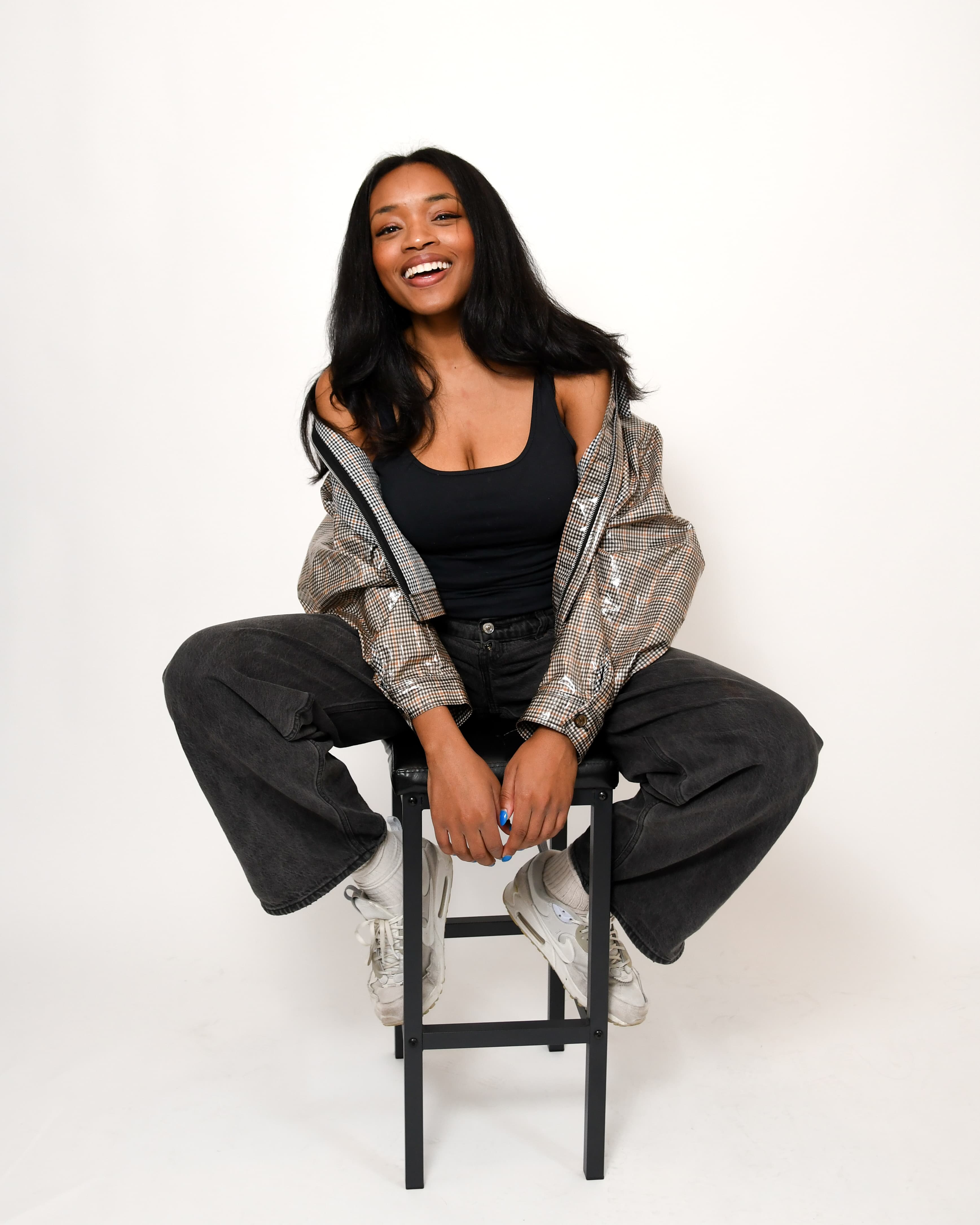 Chine sitting on a stool